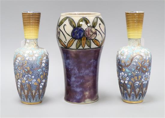 A Royal Doulton stoneware fruit decorated vase, c.1910 and a pair of Doulton Lambeth Slaters Patent bottle vases, c.1895